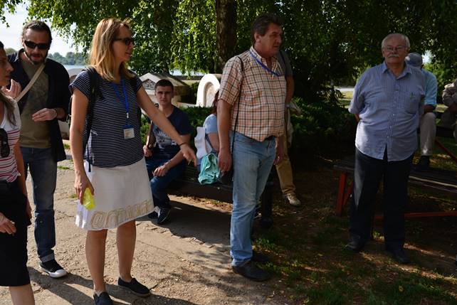 A group of people standing in a park

Description generated with very high confidence