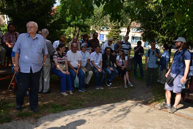 A group of people standing in front of a crowd

Description generated with very high confidence