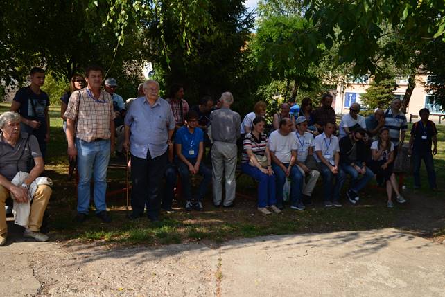 A group of people standing in front of a crowd

Description generated with very high confidence