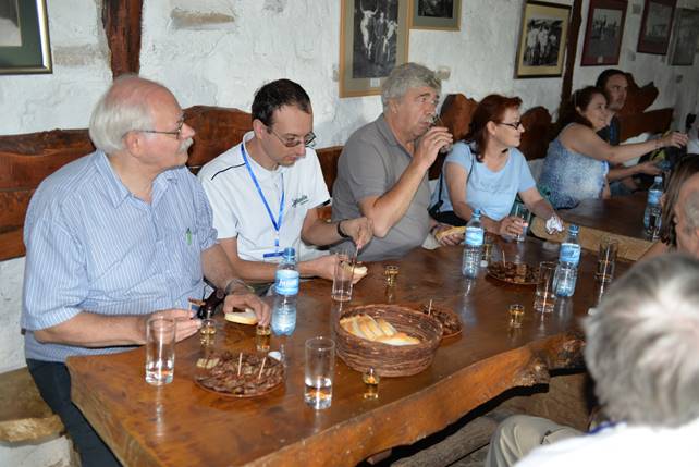 A group of people sitting at a table

Description generated with very high confidence