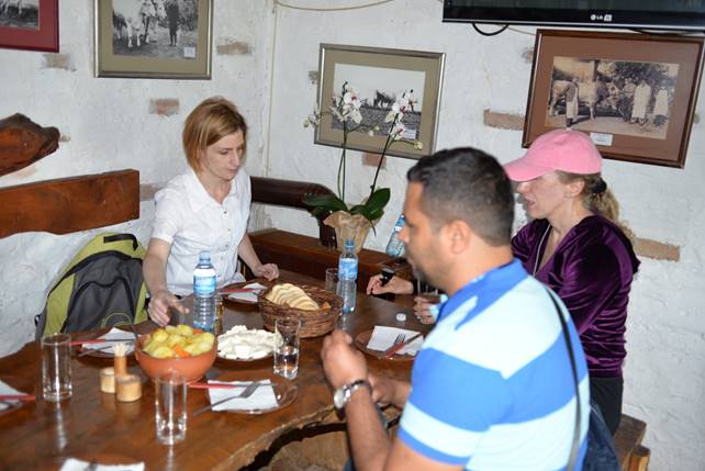 A group of people sitting at a table

Description generated with very high confidence