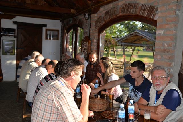 A group of people drinking wine at a restaurant

Description generated with very high confidence