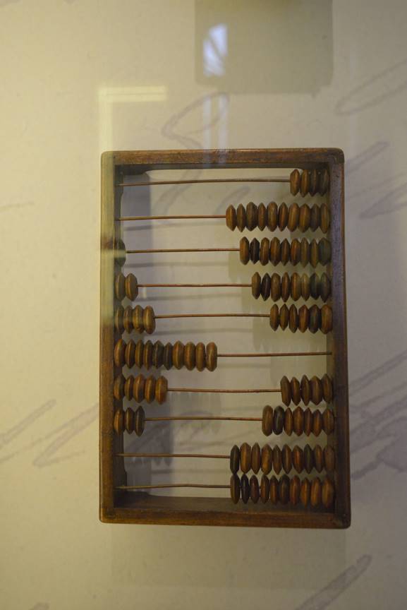 A picture containing object, wall, abacus, indoor

Description generated with very high confidence