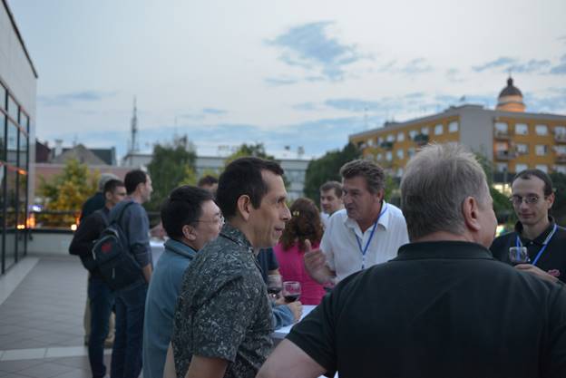 A group of people standing in front of a crowd

Description generated with very high confidence