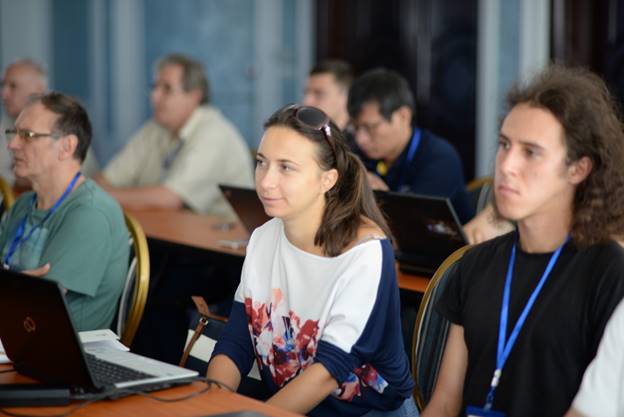 A group of people sitting at a table

Description generated with very high confidence