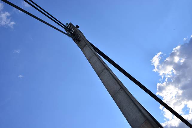 A crane flying over a building

Description generated with high confidence