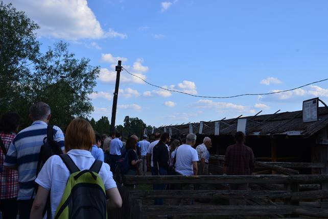 A group of people standing in front of a crowd

Description generated with very high confidence