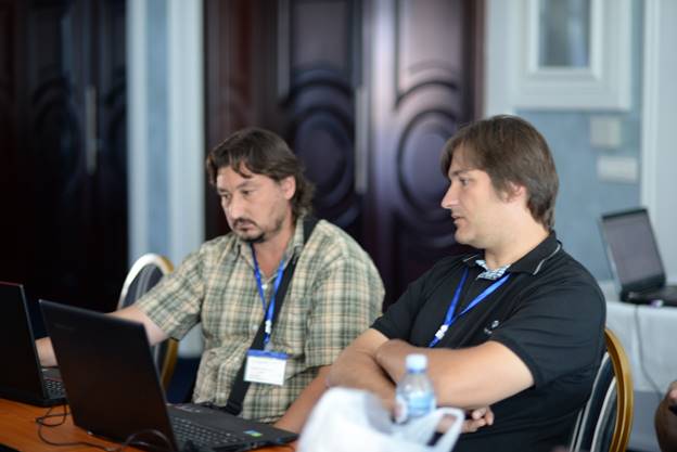 A person sitting at a table using a computer

Description generated with very high confidence