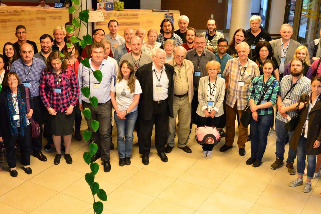 A group of people posing for a photo

Description automatically generated